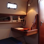 modern wooden sailboat charting mahogany