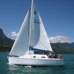 modern wooden sailboat cruising